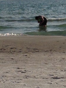 Dipping his toes int the ocean. (AKA - having his sea bath.)