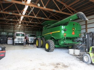 Janet, Emily, and Mary next to some giant farm equipment belonging to Cousin Bill.